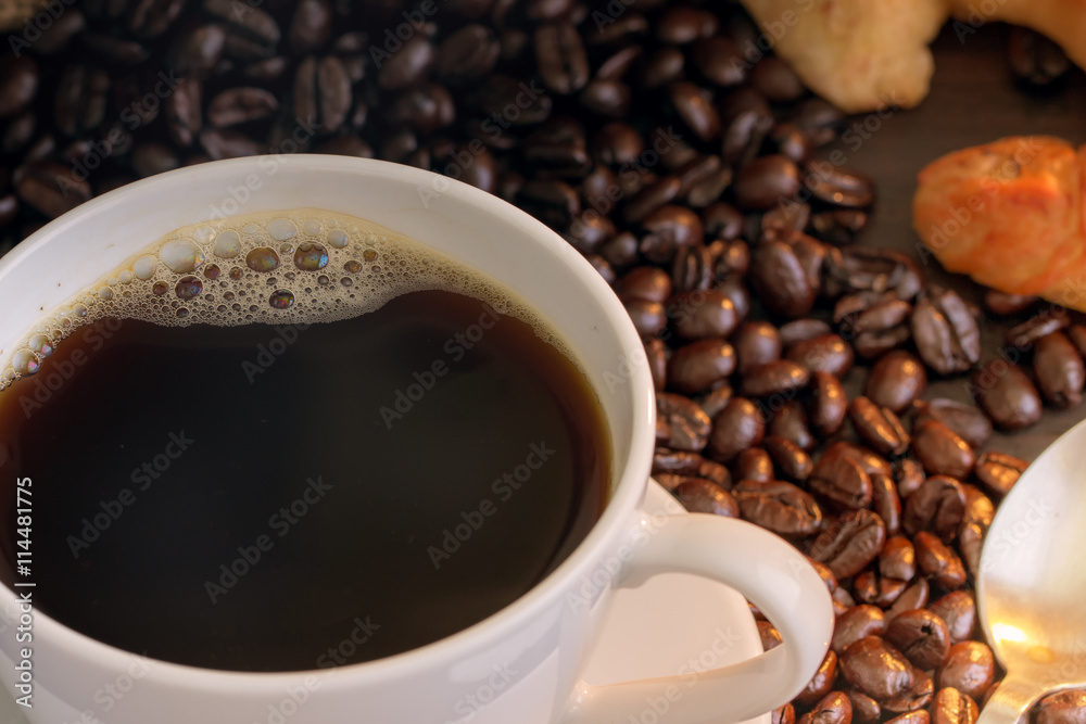 Fototapeta premium Hot coffee and croissant on wood table