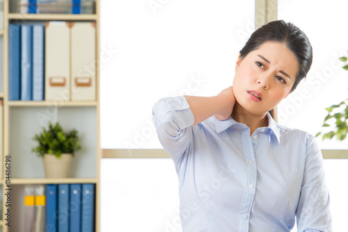 Free Download Young asian business woman with pain in neck - GFXLoad