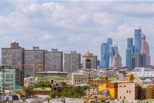 Aerial view of Moscow city withMoscow City, Houses at New Arbat, Royal Hotel Radisson (Hotel Ukraina) at sunny day with beautiful white clouds. photo