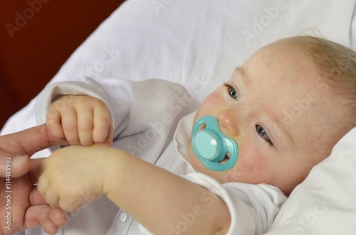 Baby boy suffering from sixth disease (three-day-fever or Roseola). Its manifestations are limited to a transient rash (