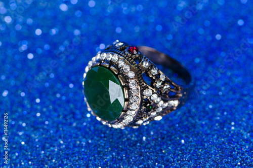 Jewellery ring against blue background
