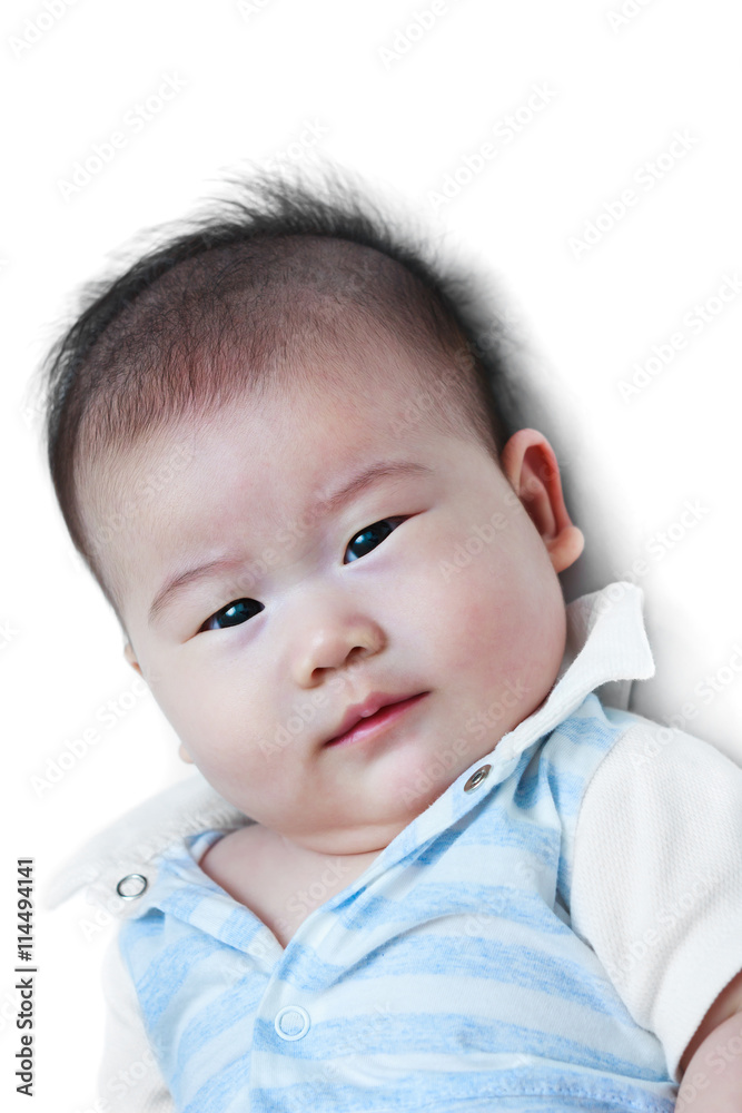 Closeup happy little baby looking at camera while lying in bed. Closeup happy little baby looking at camera while lying in bed.