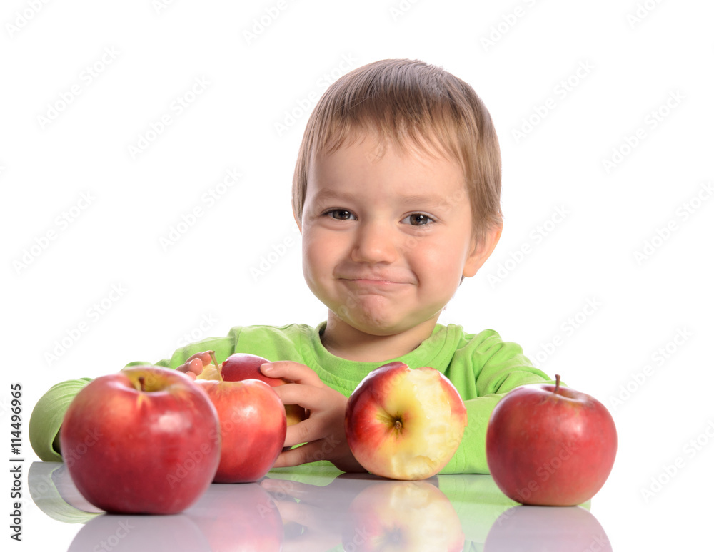 Cute child with red apples on white background