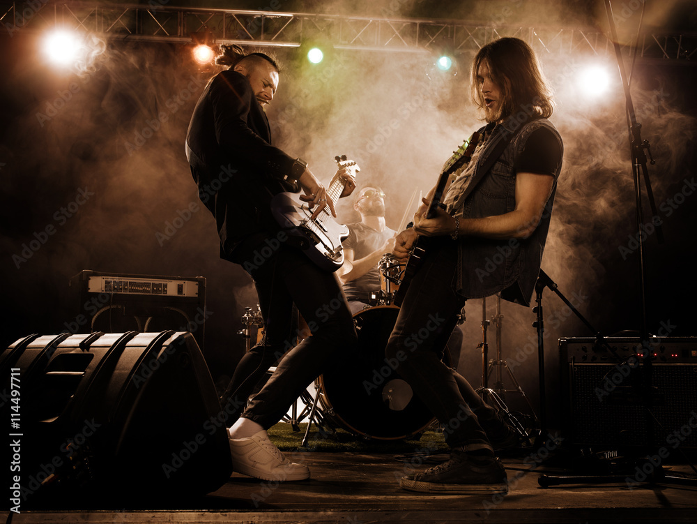 Fototapeta premium Rock band performs on stage.