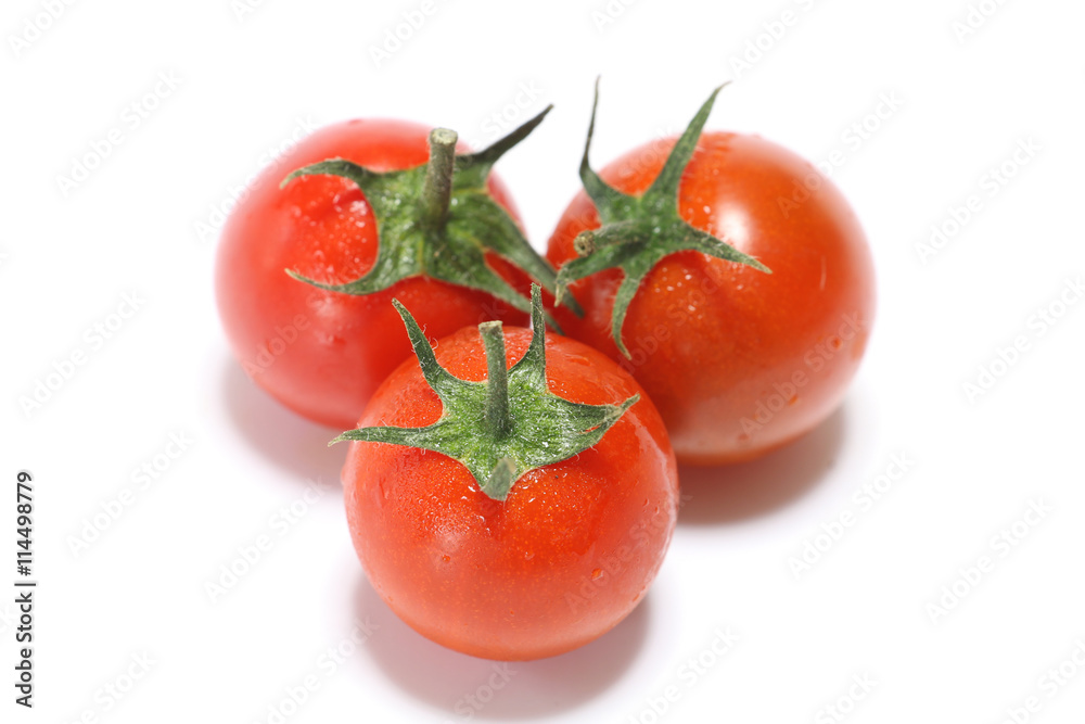 fresh small red tomato close up