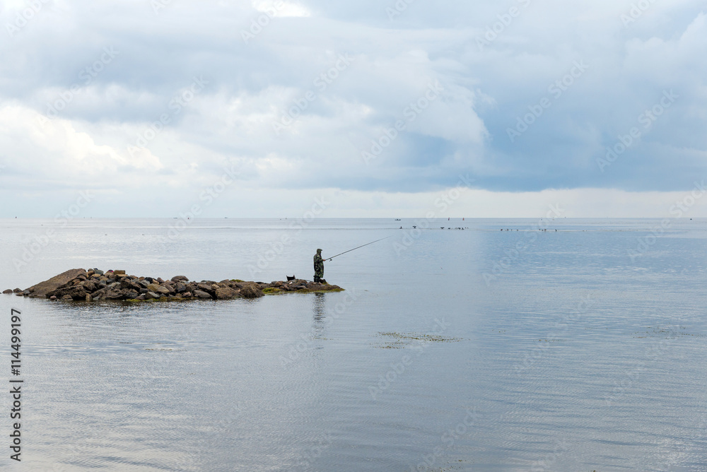 fisherman fishing on a lake