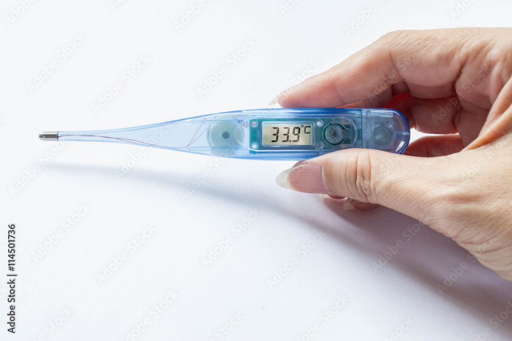 Obraz premium transparent blue digital thermometer in hand