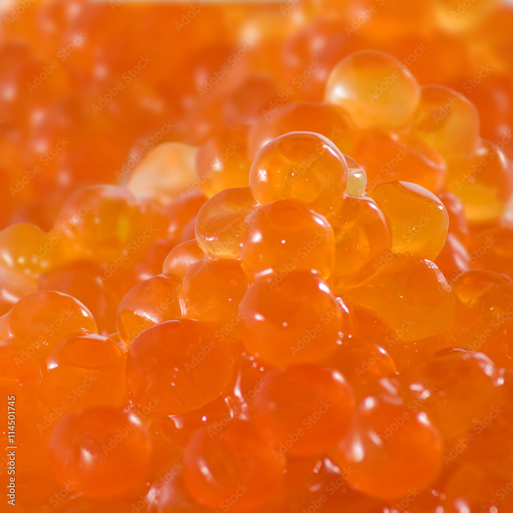 Isolated image of red caviar on a white background closeup Isolated image of red caviar on a white background closeup