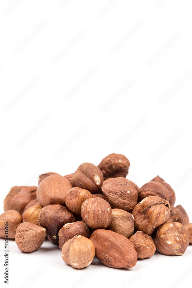 Bunch of hazelnuts over white background with copy space Bunch of hazelnuts over white background with copy space