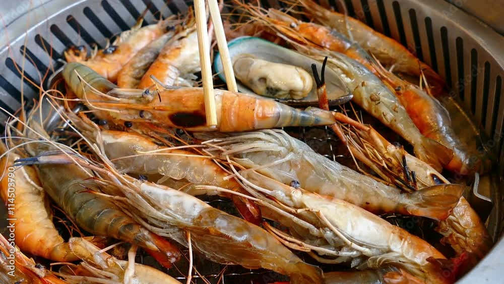 prawn shrimp grilling on charcoal stove
prawn shrimp grilling on charcoal stove