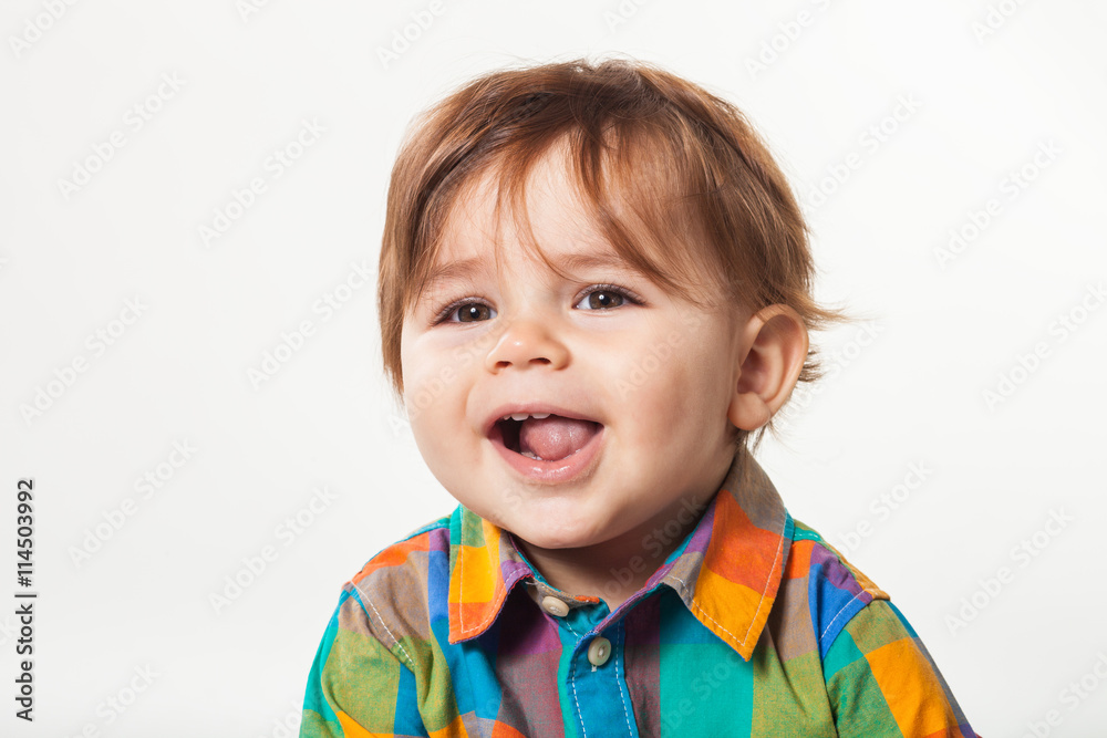 Emotional little boy in a color shirt Emotional little boy in a color shirt
