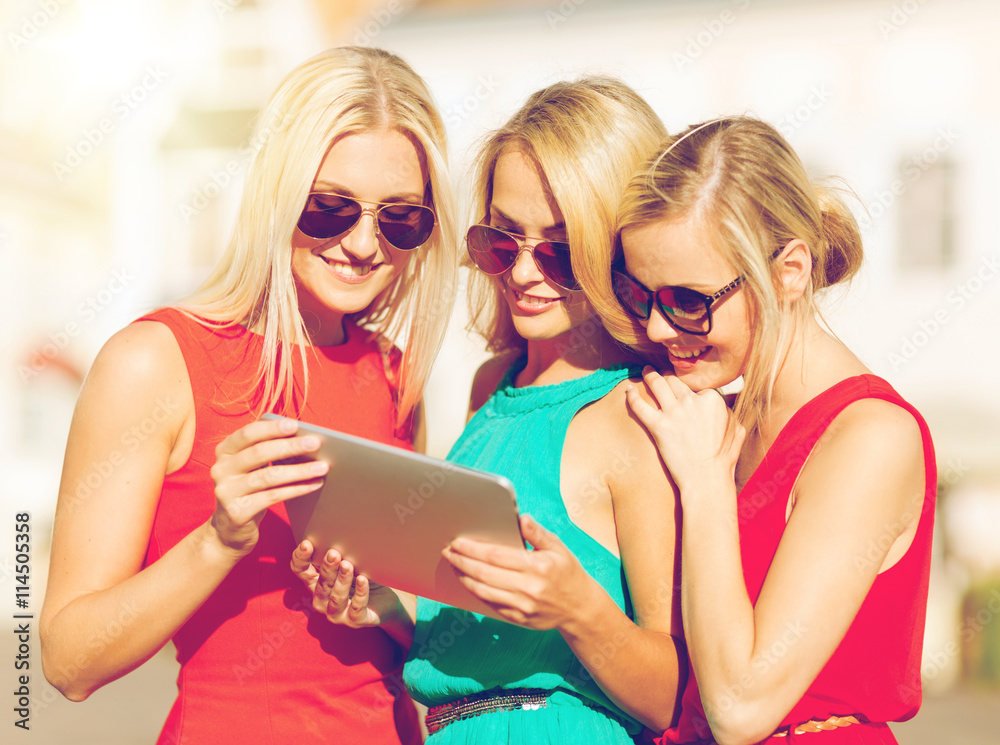 beautiful girls toursits looking into tablet pc beautiful girls toursits looking into tablet pc