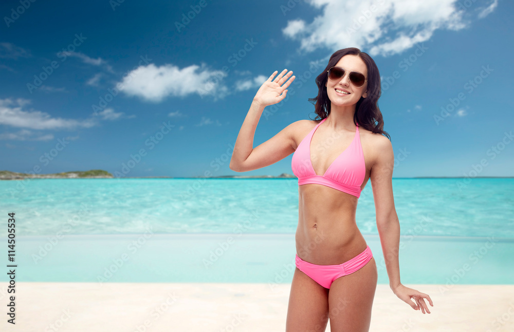 happy woman in sunglasses and bikini swimsuit