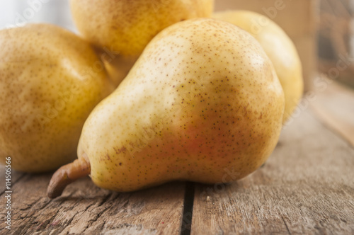 Fruit background. Fresh organic pears on old wood. Pear autumn harvest