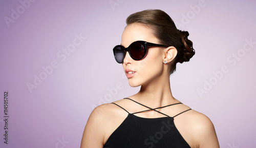 beautiful young woman in elegant black sunglasses