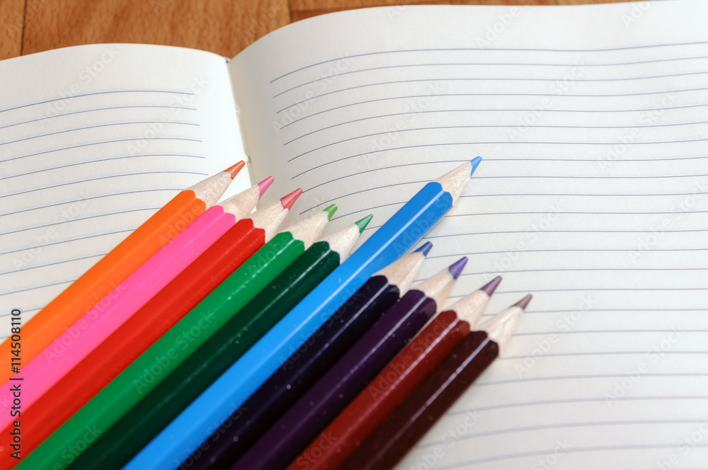 Blank notebook with color pencil. Education concept. Blank notebook with color pencil. Education concept.