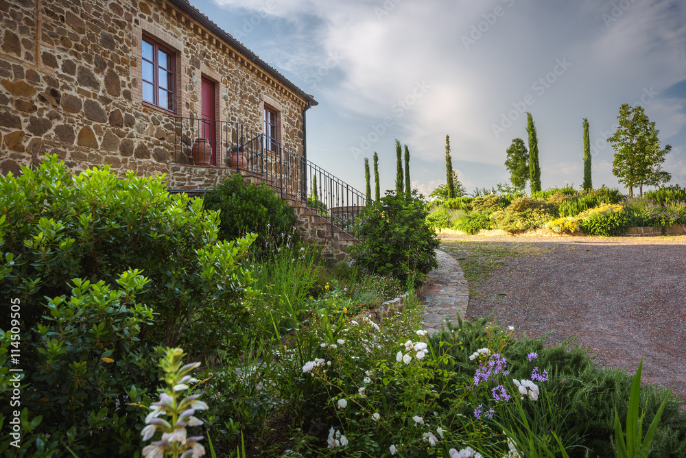Fototapeta premium Beautiful old house with stones in spring day.