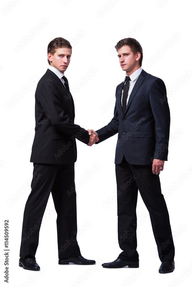 Two twin brothers handshaking isolated on white Two twin brothers handshaking isolated on white