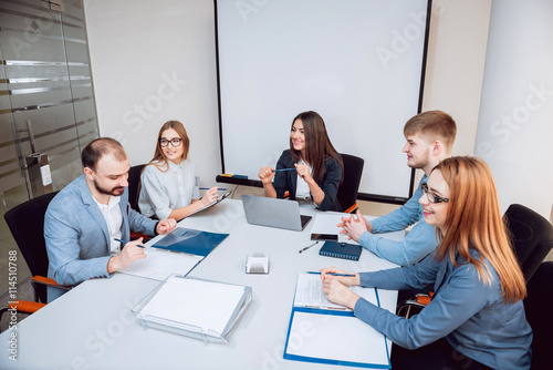 Team meeting. Discussion of business strategy.