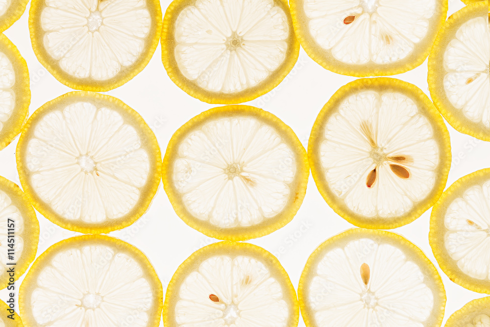 Slices of lemon on a white background. Pattern. Macro. Fruit background. Slices of lemon on a white background. Pattern. Macro. Fruit background.