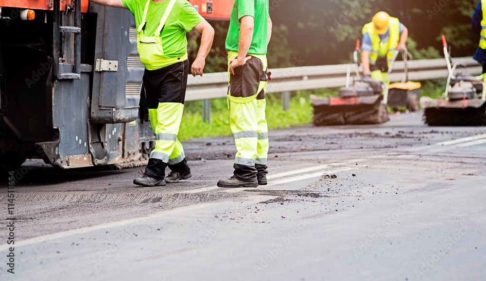 Fototapeta premium Summer road work. Road renewal.