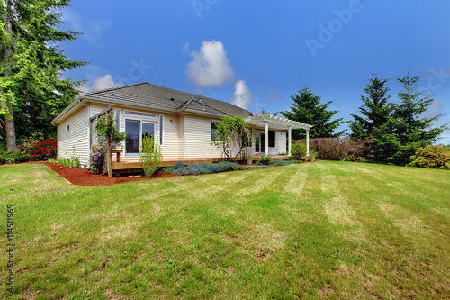 Small American home. large grass filled lawn