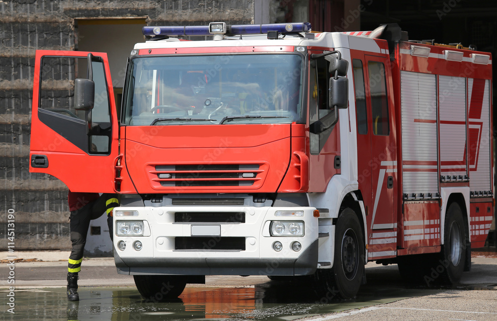 fire engine truck during an exercise in fire brigade station