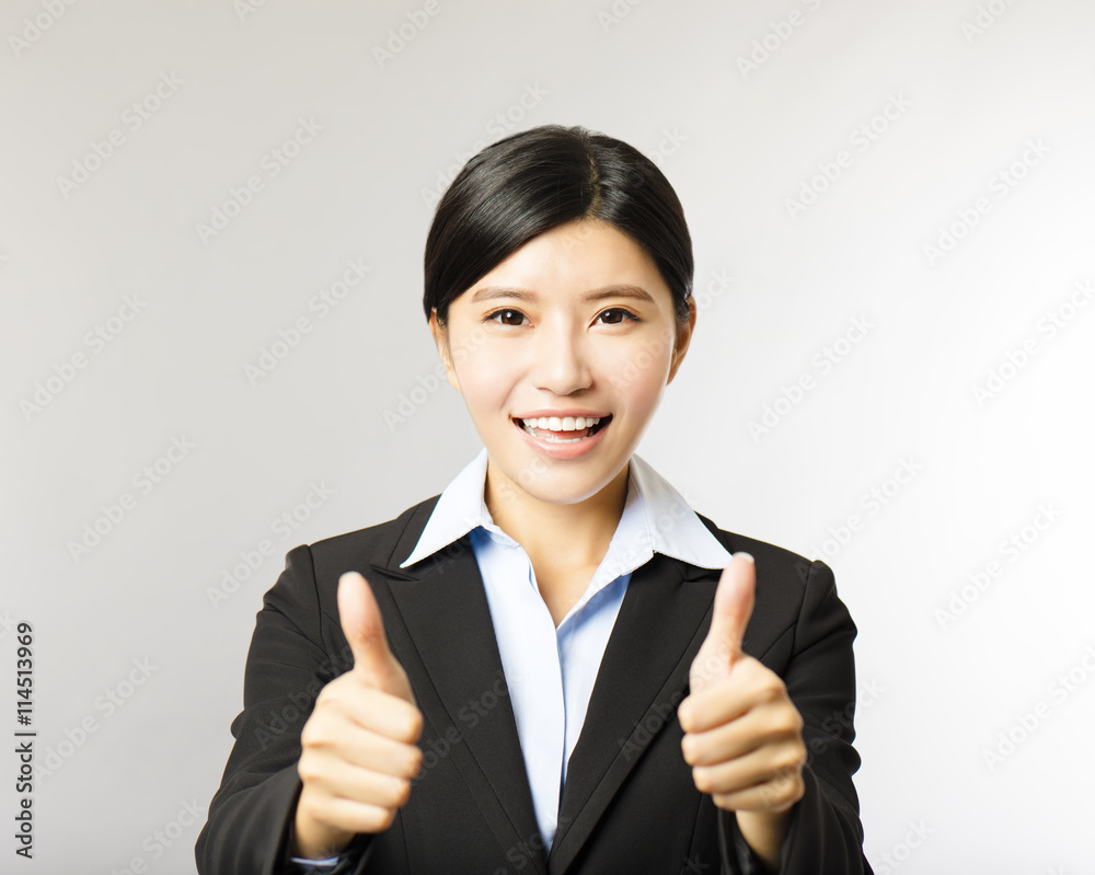 young smiling business woman with thumb up gesture young smiling business woman with thumb up gesture