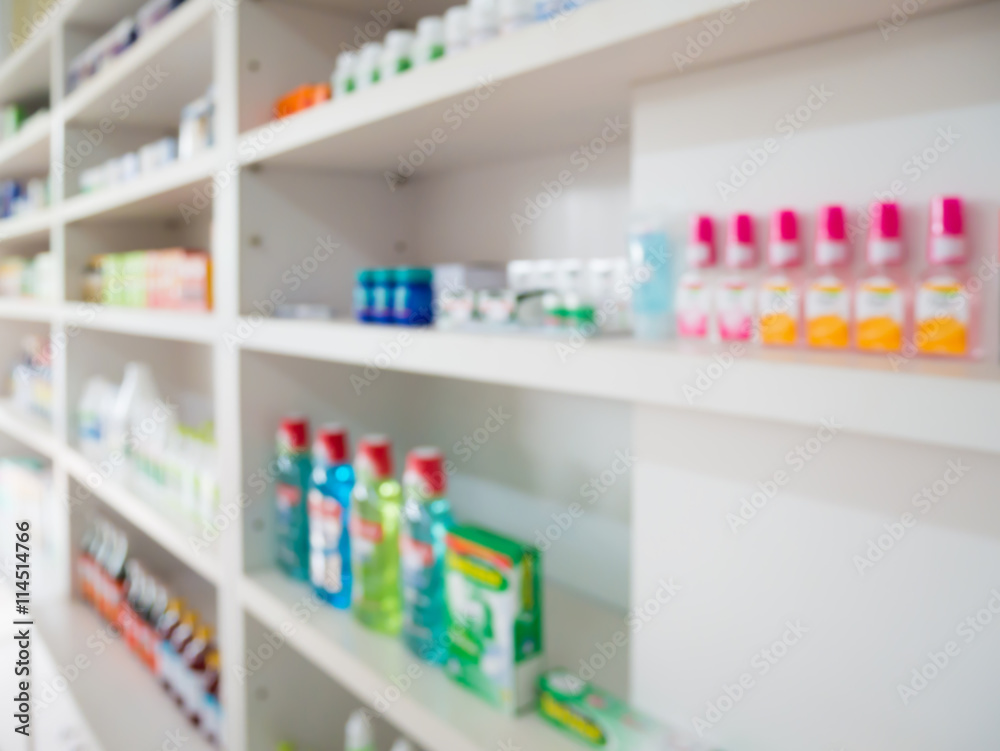 Close up of medicine bottles on shelves of drugs in the pharmacy