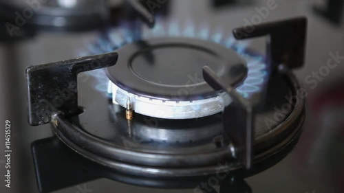 gas stove, lit the gas, kitchen gas cooker with burning torch, the flame of burning gas in the kitchen