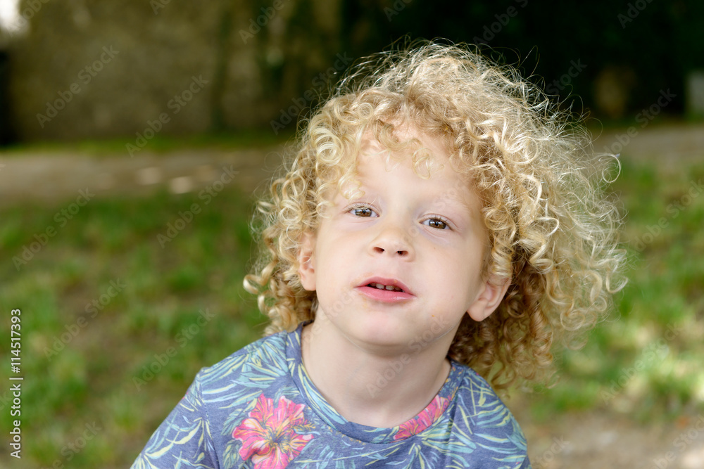 portrait of a young boy with blond curly hair portrait of a young boy with blond curly hair