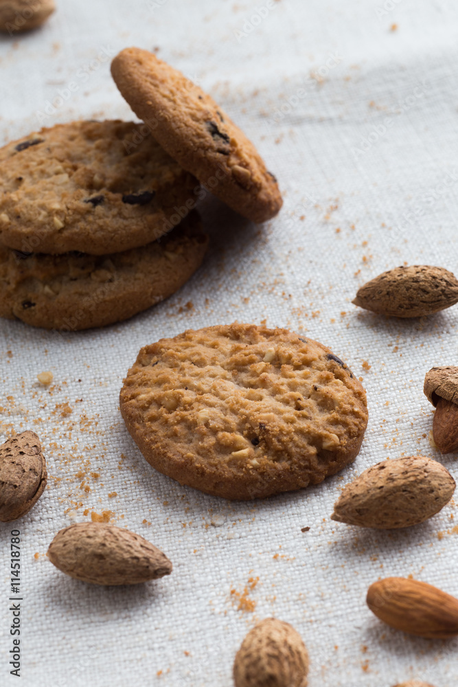 Cookies pile with chocolate chip and almond on light textile background. Delicious morning snacks for breakfast, brunch and lunch. Appetizing, healthy and fast food
Cookies pile with chocolate chip and almond on light textile background. Delicious morning snacks for breakfast, brunch and lunch. Appetizing, healthy and fast food