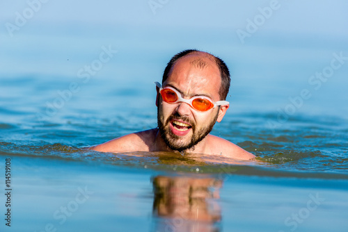 young man swimming in the sea