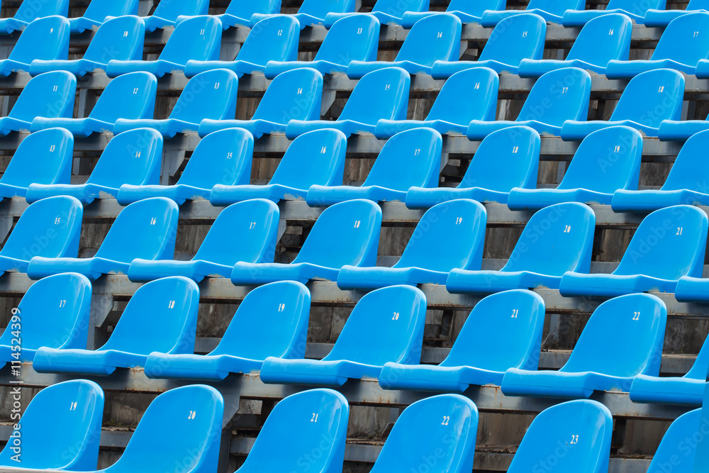 Fototapeta premium Background of empty blue seats in a stadium