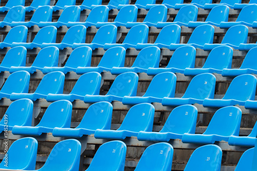 Background of empty blue seats in a stadium