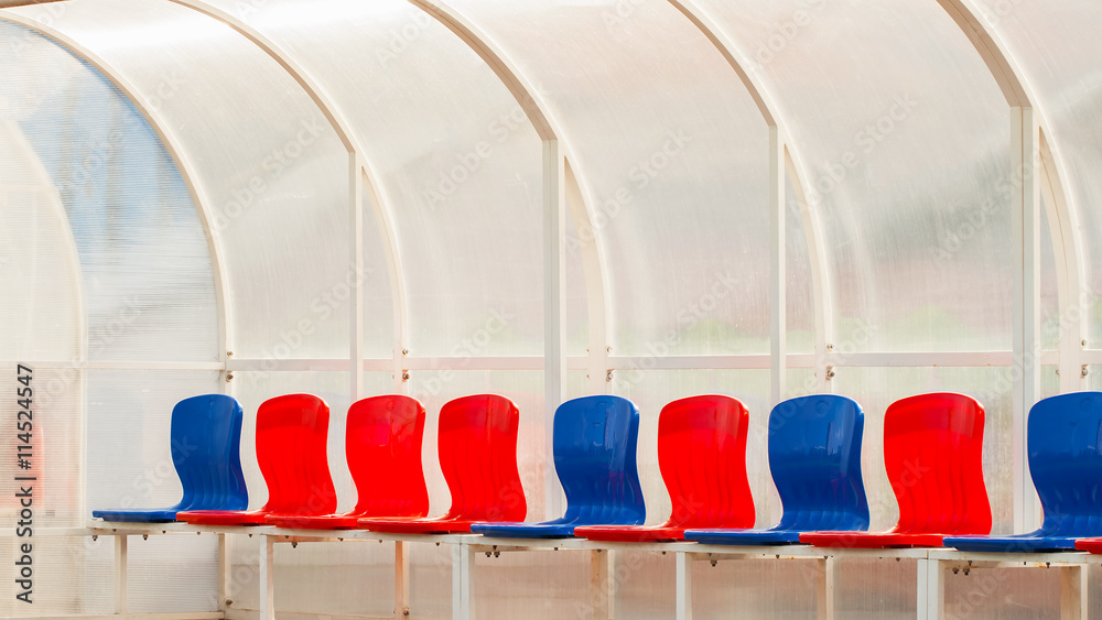 Fototapeta premium Empty bright seats in stadium for football teams