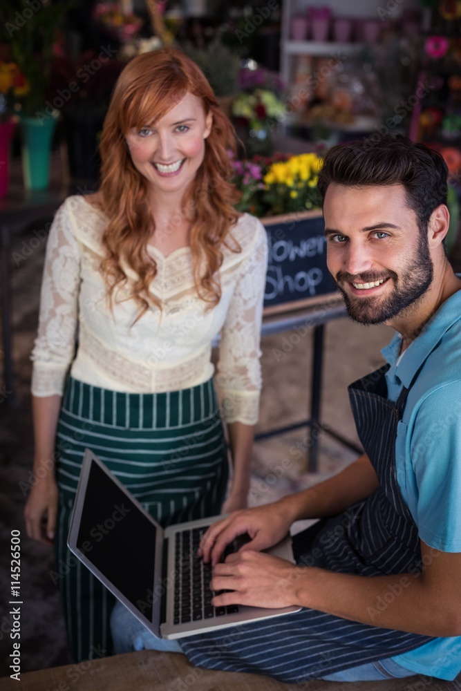 Portrait of happy couple using laptop Portrait of happy couple using laptop