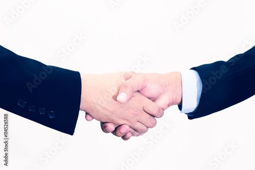 Closeup of businessmans handshake isolated on white background.