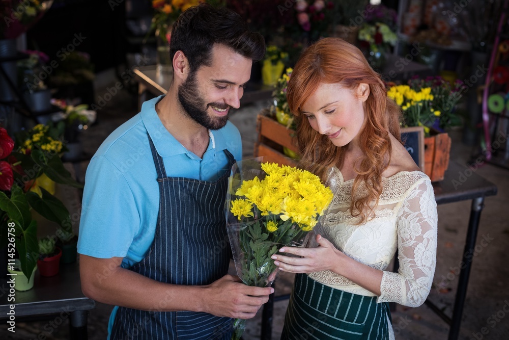 Couple holding flower bouquet Couple holding flower bouquet