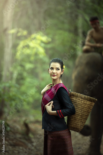 Mahout woman in traditional dress of Thailand