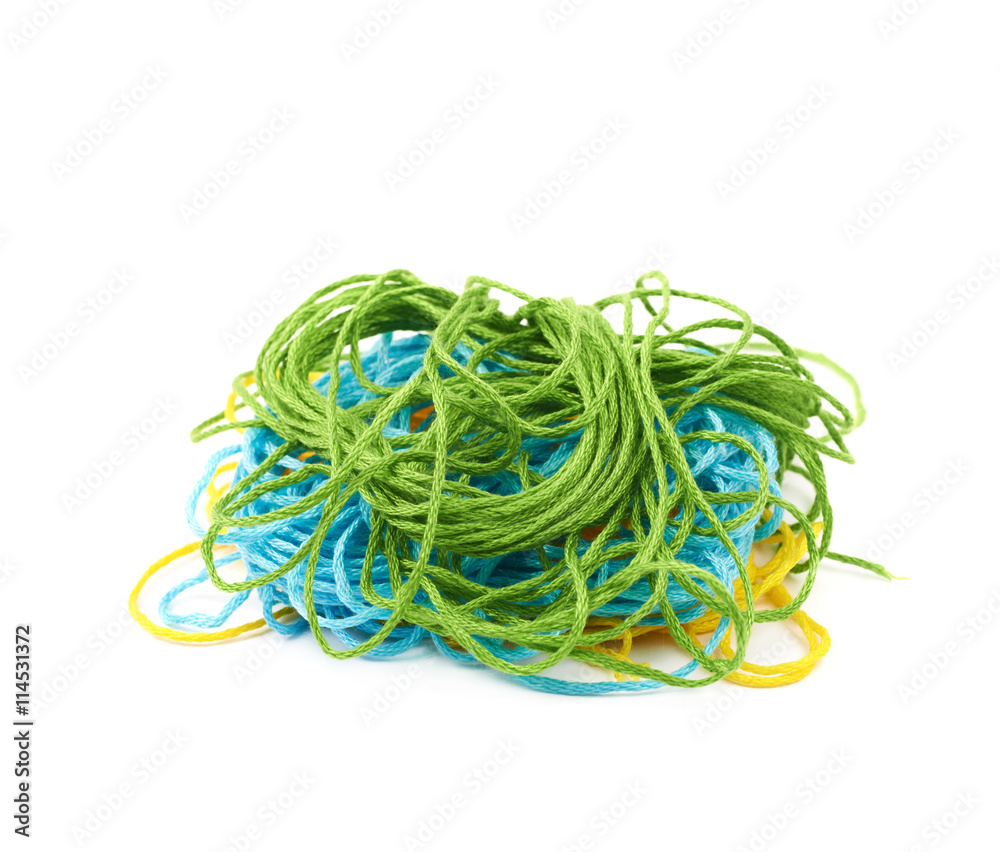 Mixed pile of yarn threads isolated