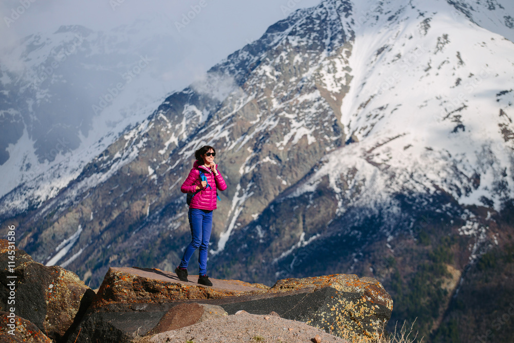 Active tourist woman enjoying the view. The Caucasus
