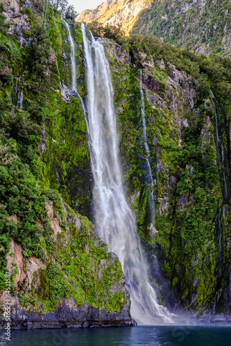A narrow waterfall at Milford Sound, New Zealand