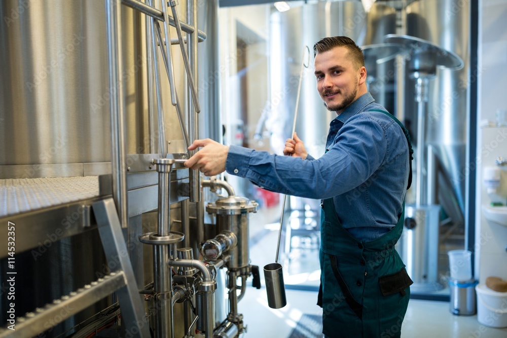 Brewer working at brewery