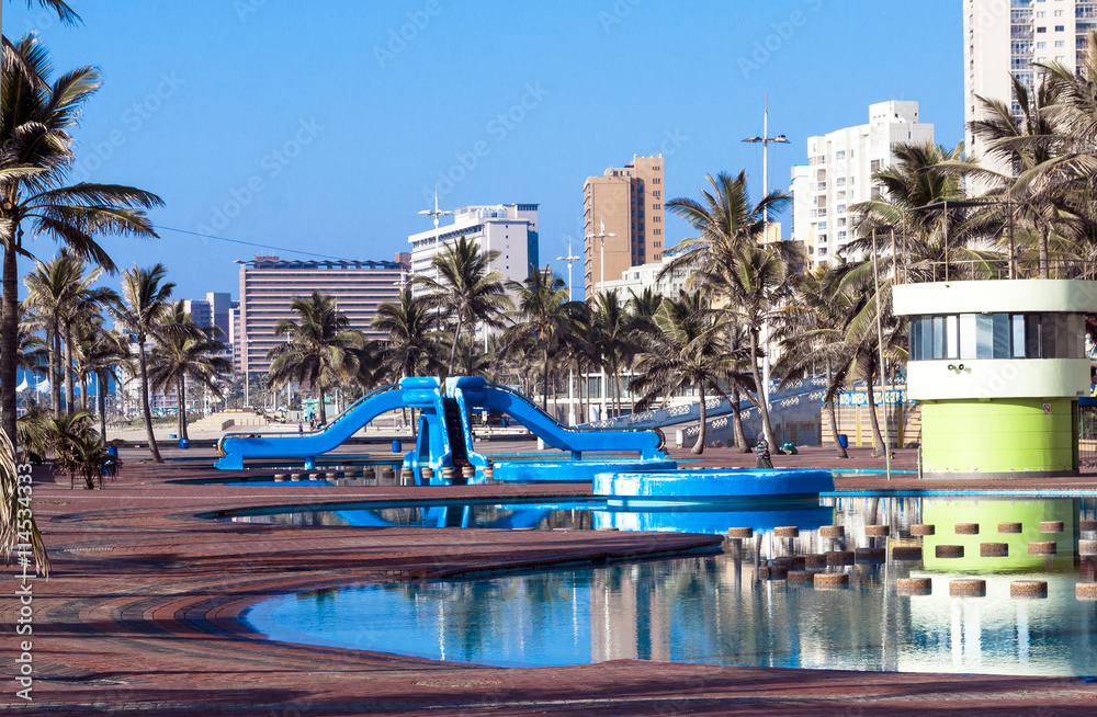 Blue Swimming Recreational Pool Area and Palm Trees