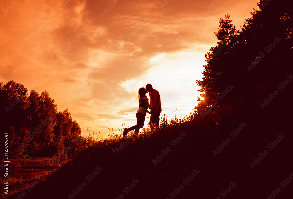 Young couple at sunset in the park.