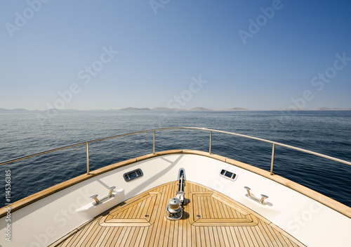 Wide angle shot of front of the yacht in summer time © photogoricki