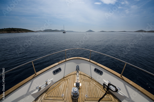 Wide angle shot of front of the yacht in summer time