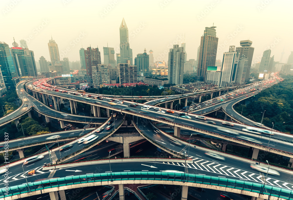 Obraz premium Large highway junction in Shanghai, China with traffic. Famous landmark of Shanghai in the evening.
