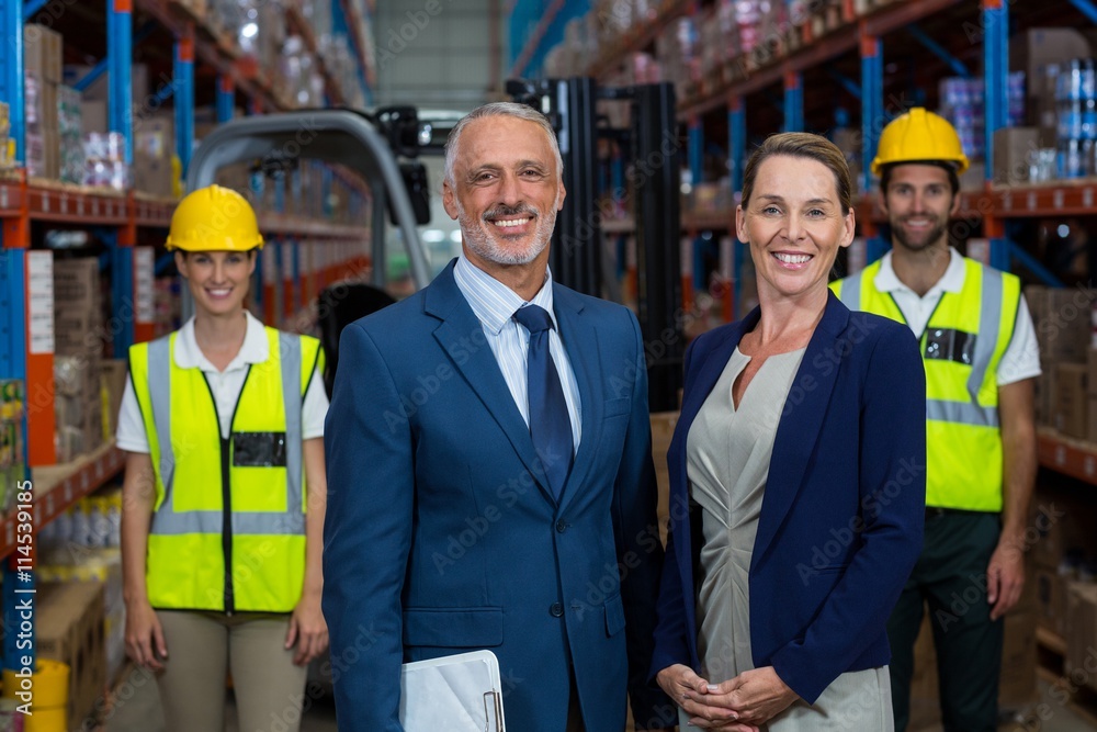 Happy managers are posing in front of the workers Happy managers are posing in front of the workers